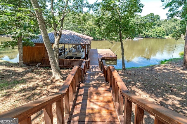 view of dock featuring a water view and boat lift