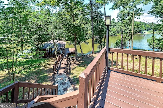 wooden terrace with a water view