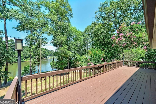 wooden deck with a water view