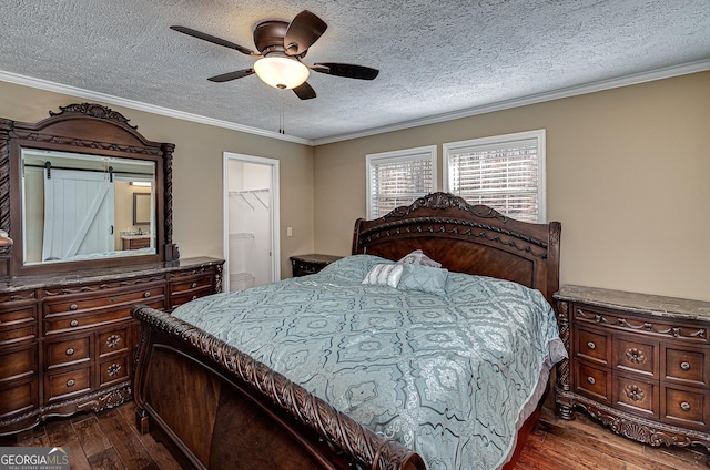 bedroom with a ceiling fan, ornamental molding, dark wood finished floors, and a textured ceiling