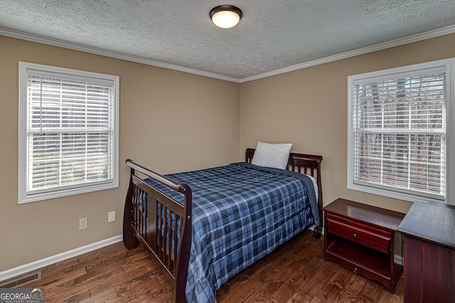 bedroom with dark wood-style floors, a textured ceiling, and crown molding