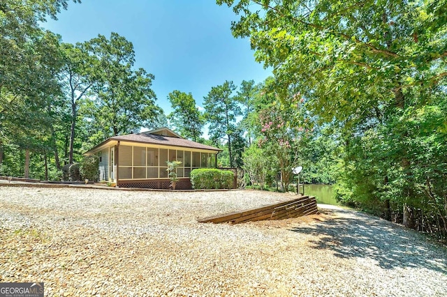 back of house with a sunroom