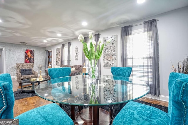 dining room featuring wood finished floors and recessed lighting