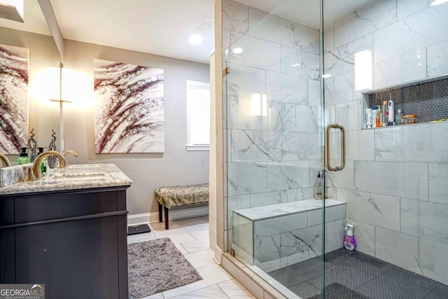 full bathroom with a stall shower, marble finish floor, vanity, and baseboards