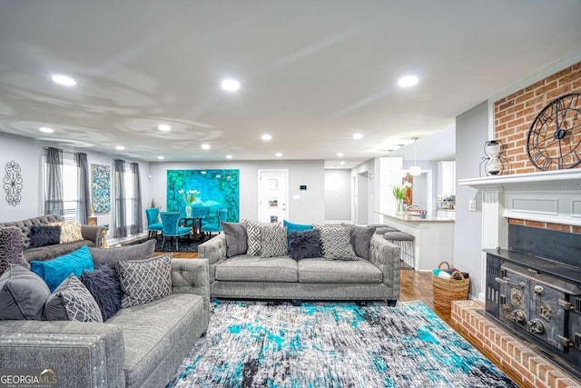 living area with recessed lighting and wood finished floors