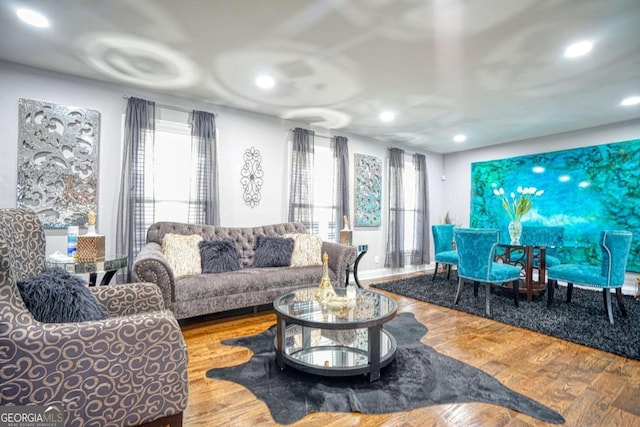 living area featuring wood finished floors and recessed lighting