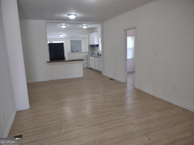 unfurnished living room with light wood-type flooring