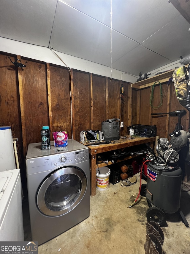 below grade area with independent washer and dryer and wood walls