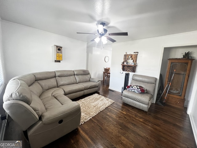 living room featuring dark hardwood / wood-style flooring and ceiling fan