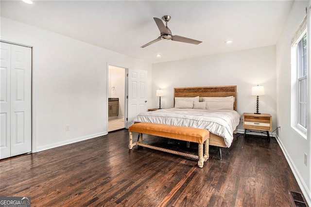 bedroom with dark hardwood / wood-style flooring, ensuite bath, and ceiling fan