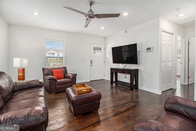 living room with dark hardwood / wood-style floors and ceiling fan