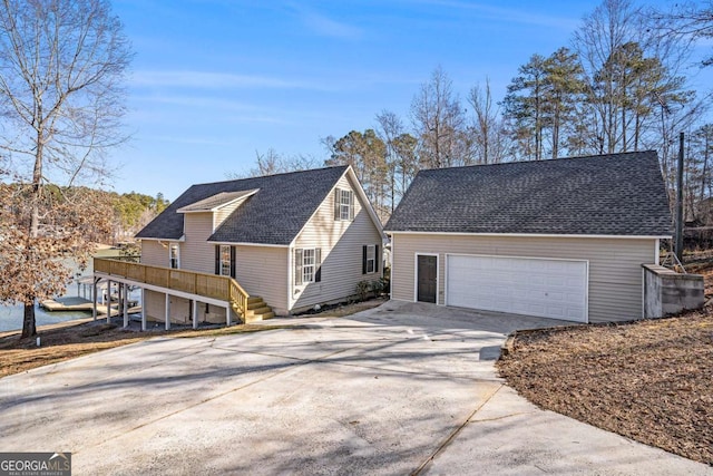 view of front of home with a garage and a deck