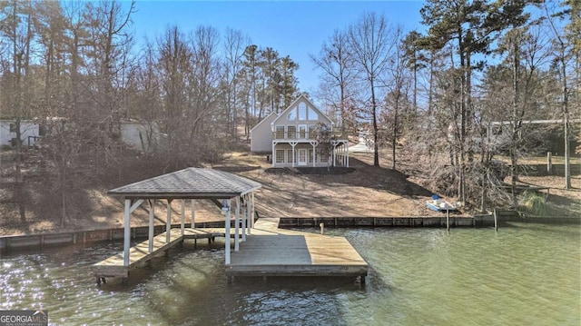 view of dock with a water view and a gazebo