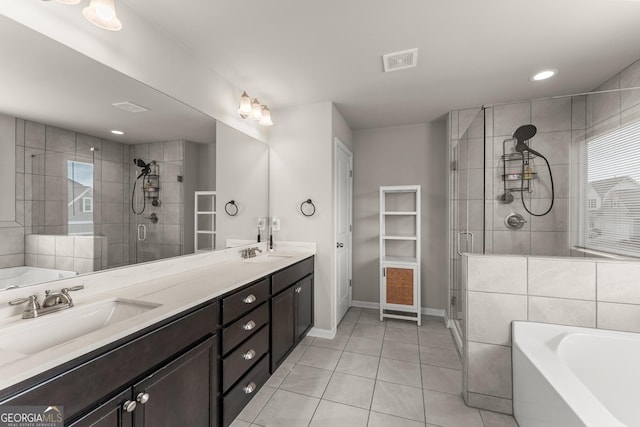 bathroom with vanity, independent shower and bath, and tile patterned flooring