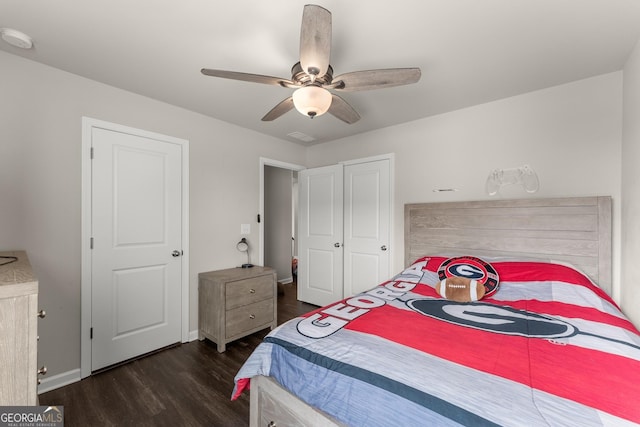 bedroom featuring dark wood-type flooring and ceiling fan