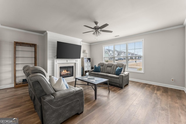 living room featuring crown molding, dark hardwood / wood-style floors, and ceiling fan