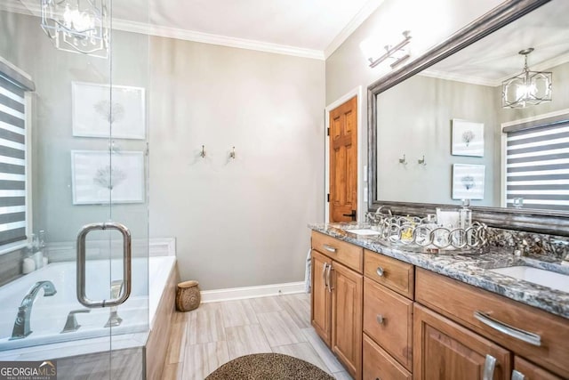 bathroom with a relaxing tiled tub, vanity, crown molding, and a chandelier