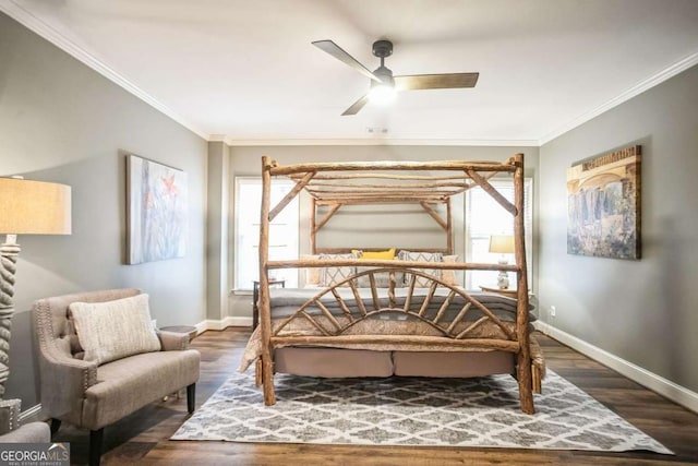 bedroom with crown molding, ceiling fan, and dark hardwood / wood-style floors