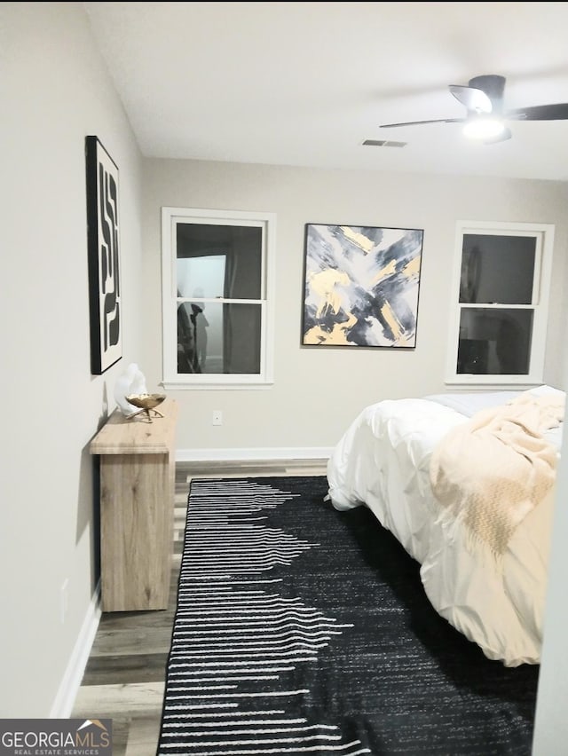 bedroom featuring ceiling fan and wood-type flooring