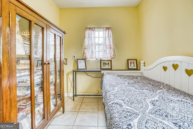 tiled bedroom with french doors