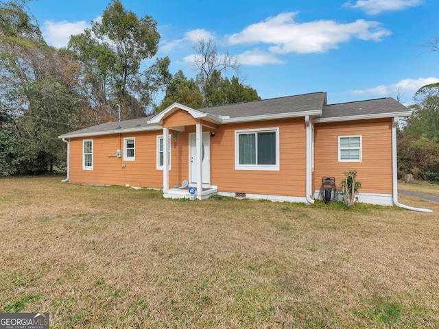 ranch-style home with a front lawn