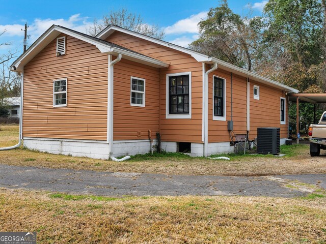 view of side of property featuring central air condition unit