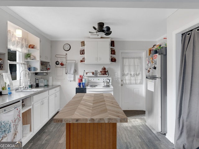 kitchen with white appliances, butcher block counters, open shelves, and a sink