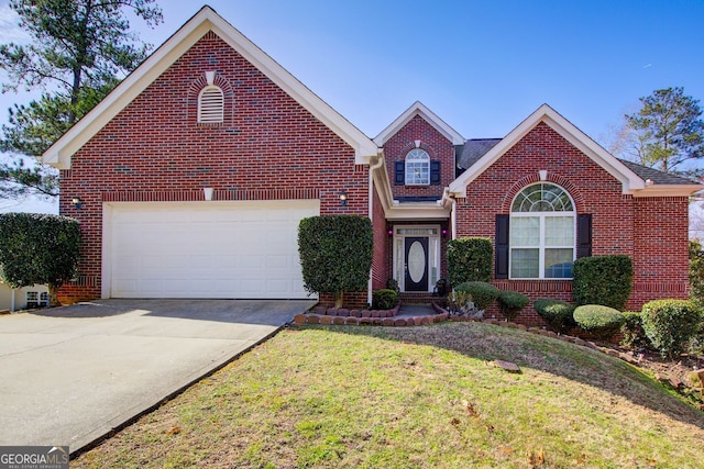 traditional-style house featuring a front lawn, brick siding, a garage, and driveway