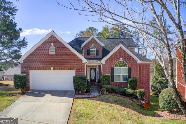 traditional-style house with brick siding, an attached garage, a shingled roof, and driveway