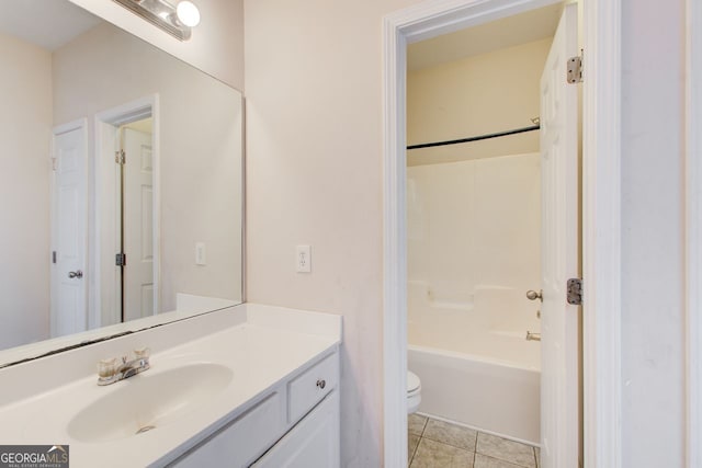 bathroom with tile patterned flooring, toilet, vanity, and shower / bathing tub combination