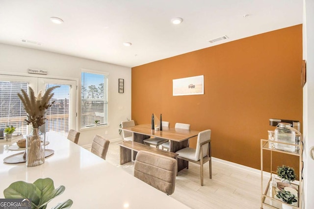 dining area with light hardwood / wood-style floors