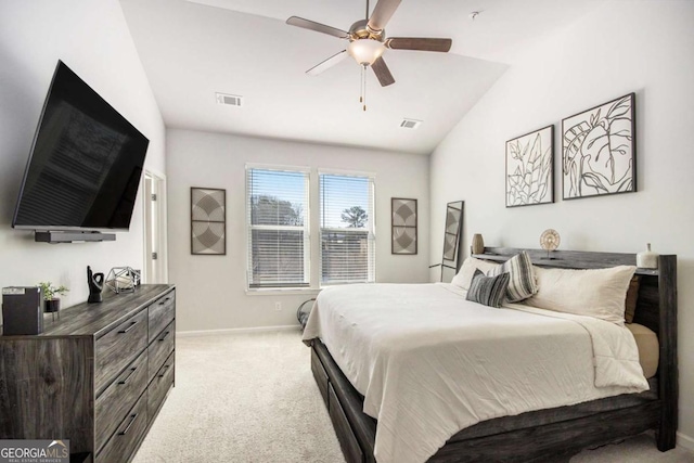 carpeted bedroom with ceiling fan and lofted ceiling