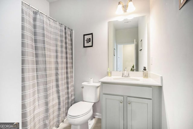 bathroom featuring vanity, toilet, and a shower with shower curtain