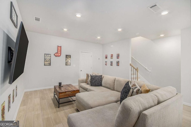 living room with light hardwood / wood-style flooring