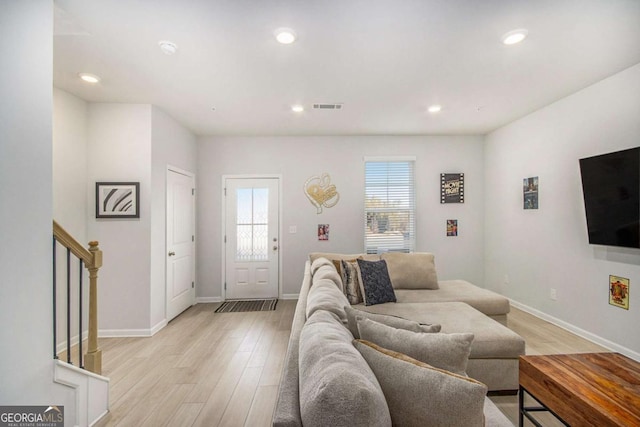 living room with light hardwood / wood-style flooring