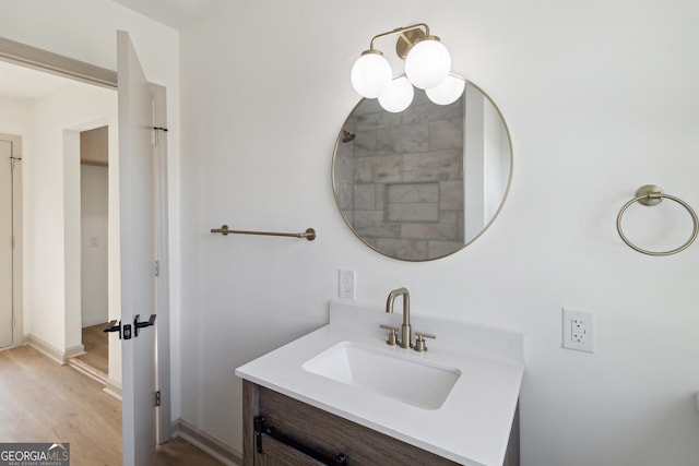 bathroom featuring vanity and hardwood / wood-style flooring