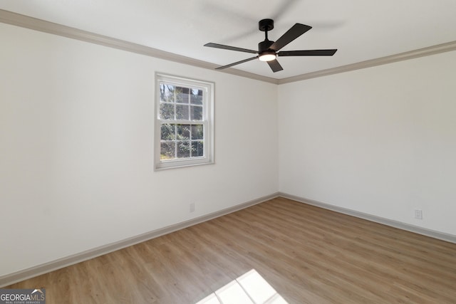 spare room with ceiling fan, ornamental molding, and light hardwood / wood-style floors