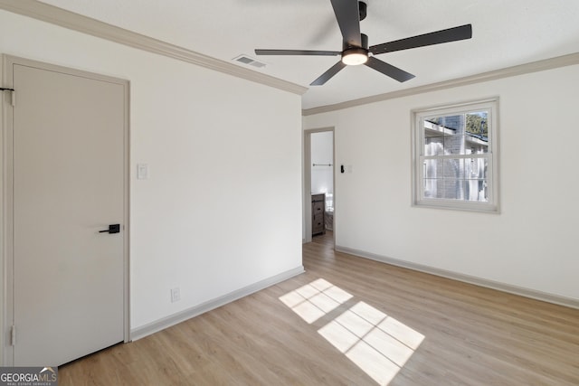 unfurnished bedroom featuring ornamental molding, light hardwood / wood-style floors, and ceiling fan