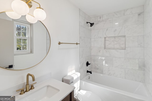 full bathroom with vanity, toilet, and tiled shower / bath combo