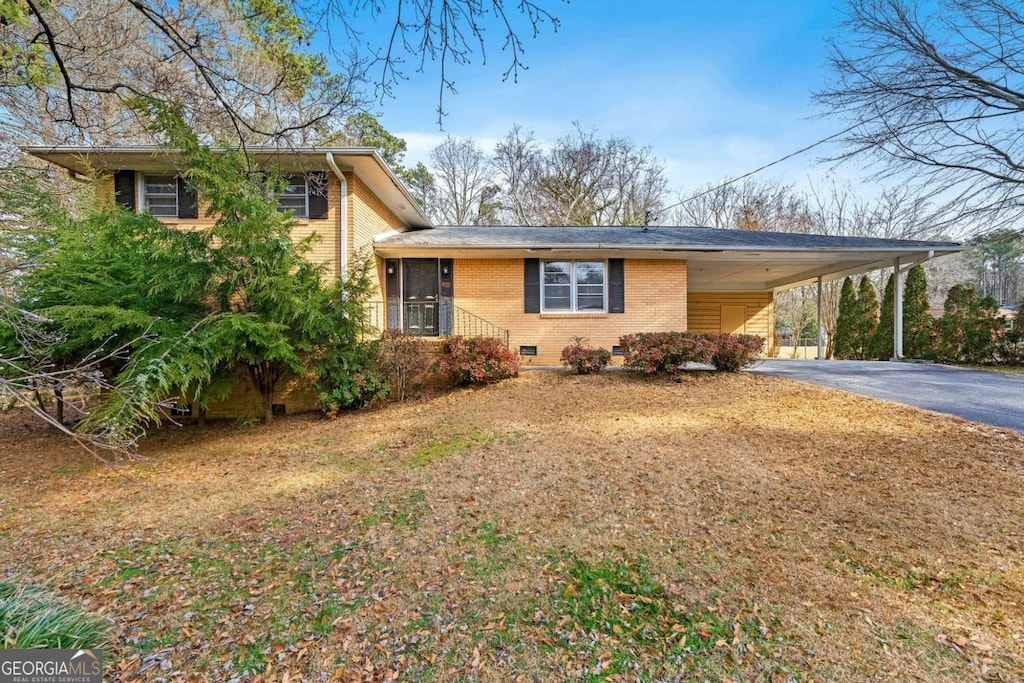 split level home featuring a carport