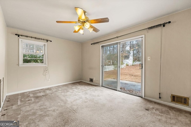 carpeted empty room with ceiling fan