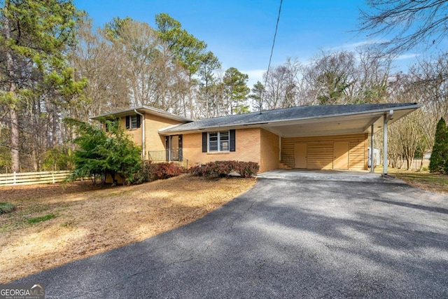 view of front of property featuring a carport