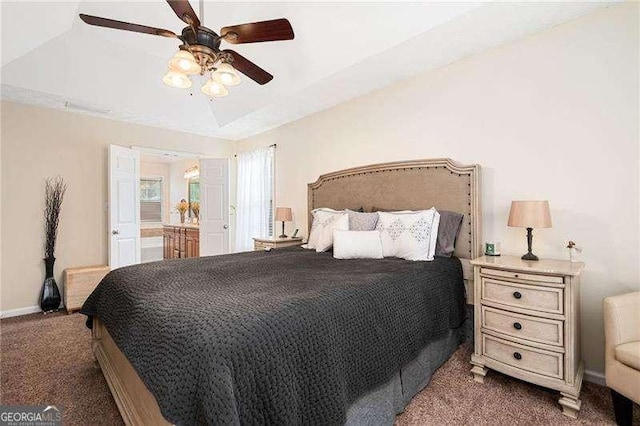 carpeted bedroom featuring ceiling fan and ensuite bath