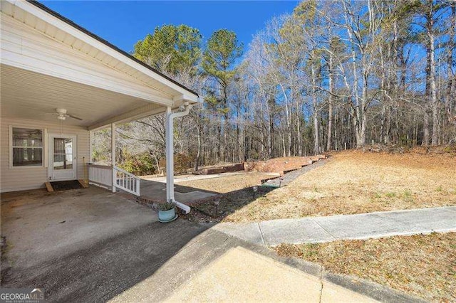 view of yard featuring ceiling fan