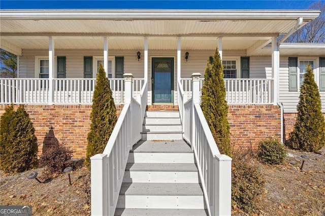 doorway to property featuring a porch