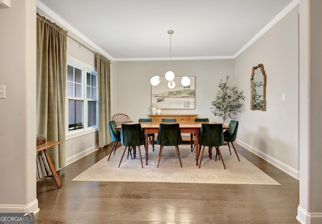 dining area featuring ornamental molding, dark hardwood / wood-style floors, and an inviting chandelier