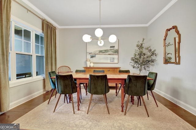 dining area with ornamental molding and hardwood / wood-style floors