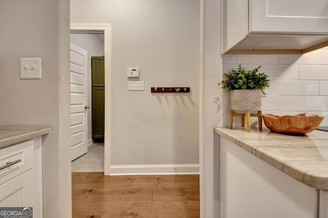 hallway with light wood-type flooring