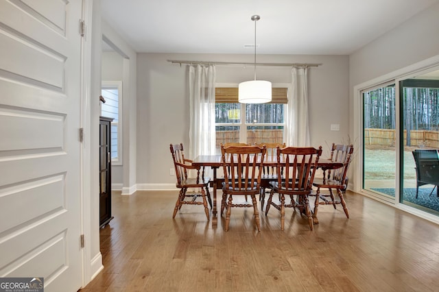 dining area featuring light wood-type flooring