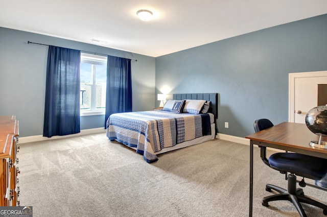 bedroom with light colored carpet